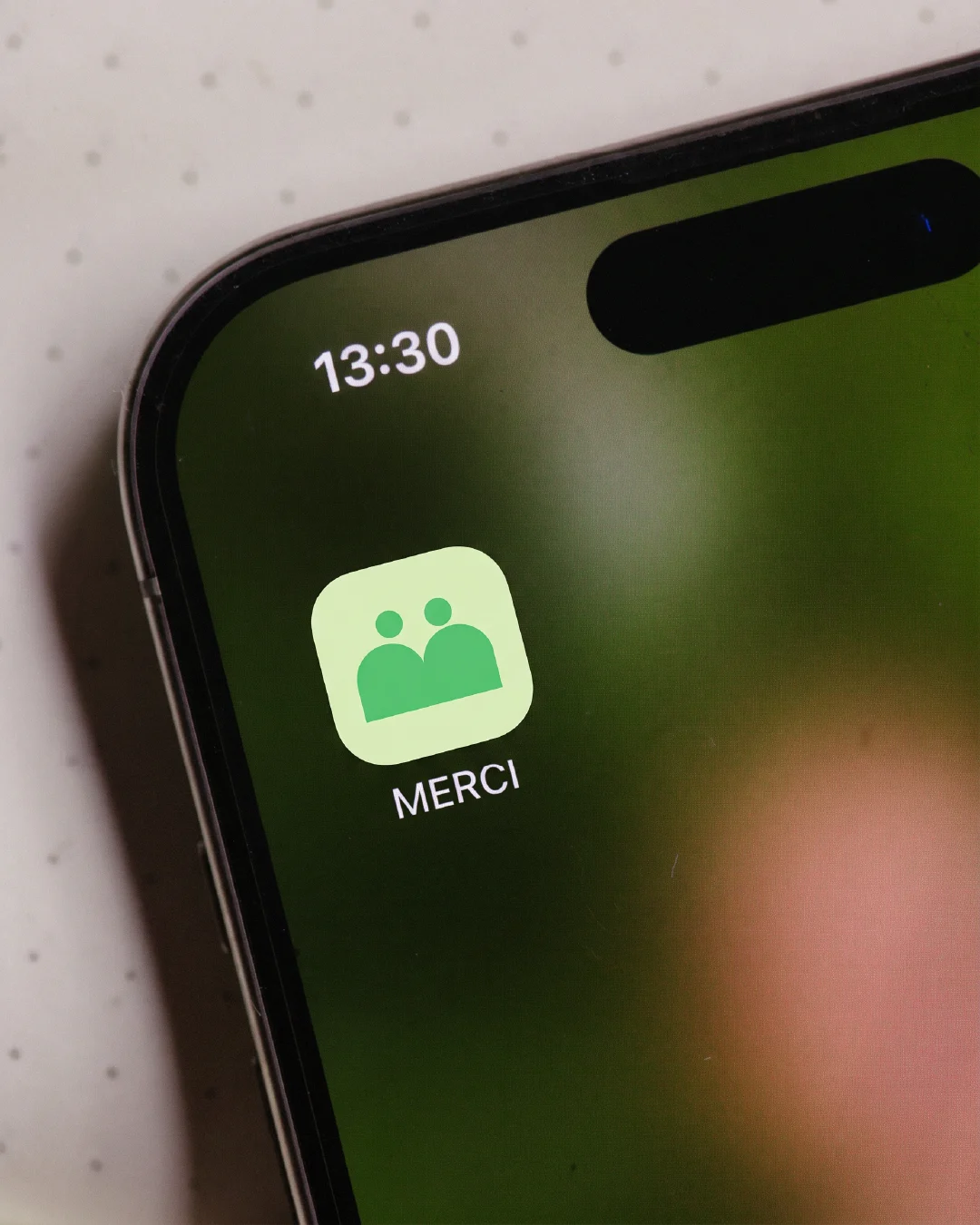 Icône de l'application MERCI sur iPhone